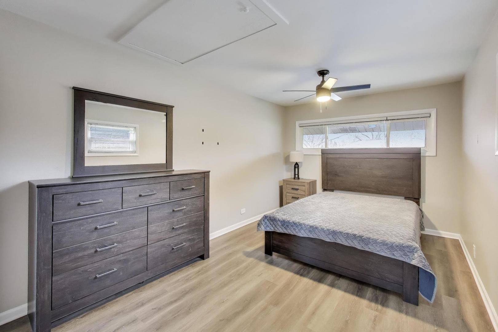540 Newark Lane Hoffman Estates, IL 60169 - Photo 12 of 23 a bedroom with a bed and a dresser