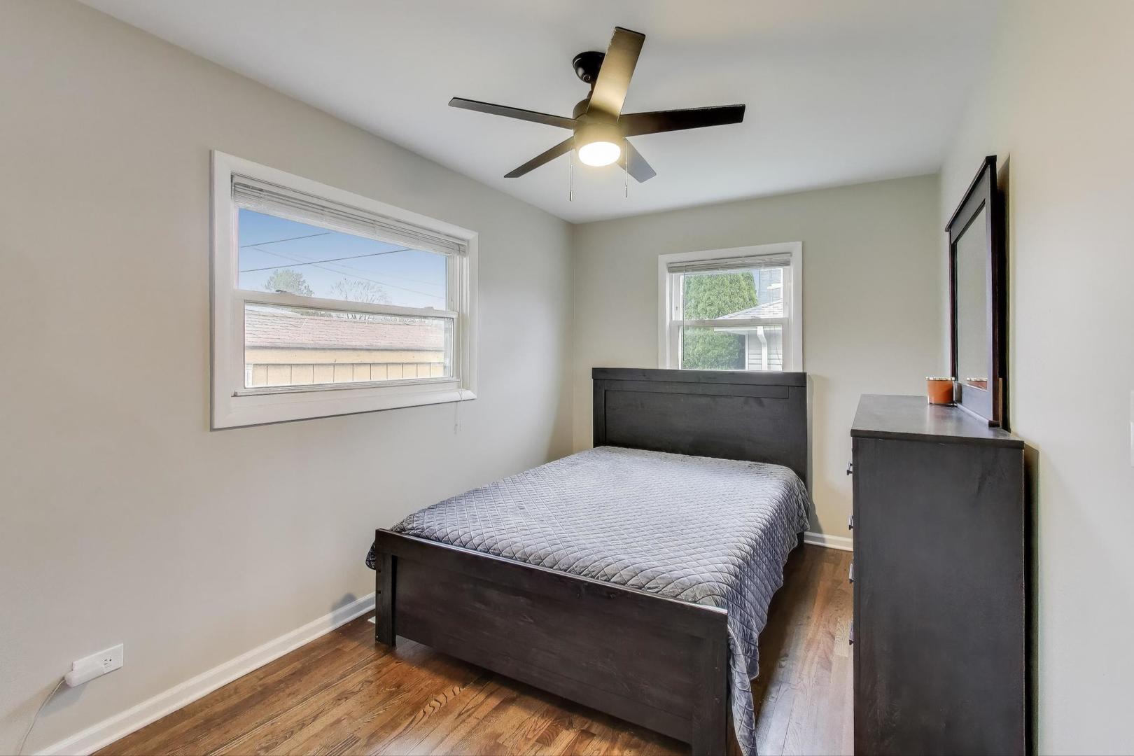 540 Newark Lane Hoffman Estates, IL 60169 - Photo 16 of 23 a bedroom with a bed and a window