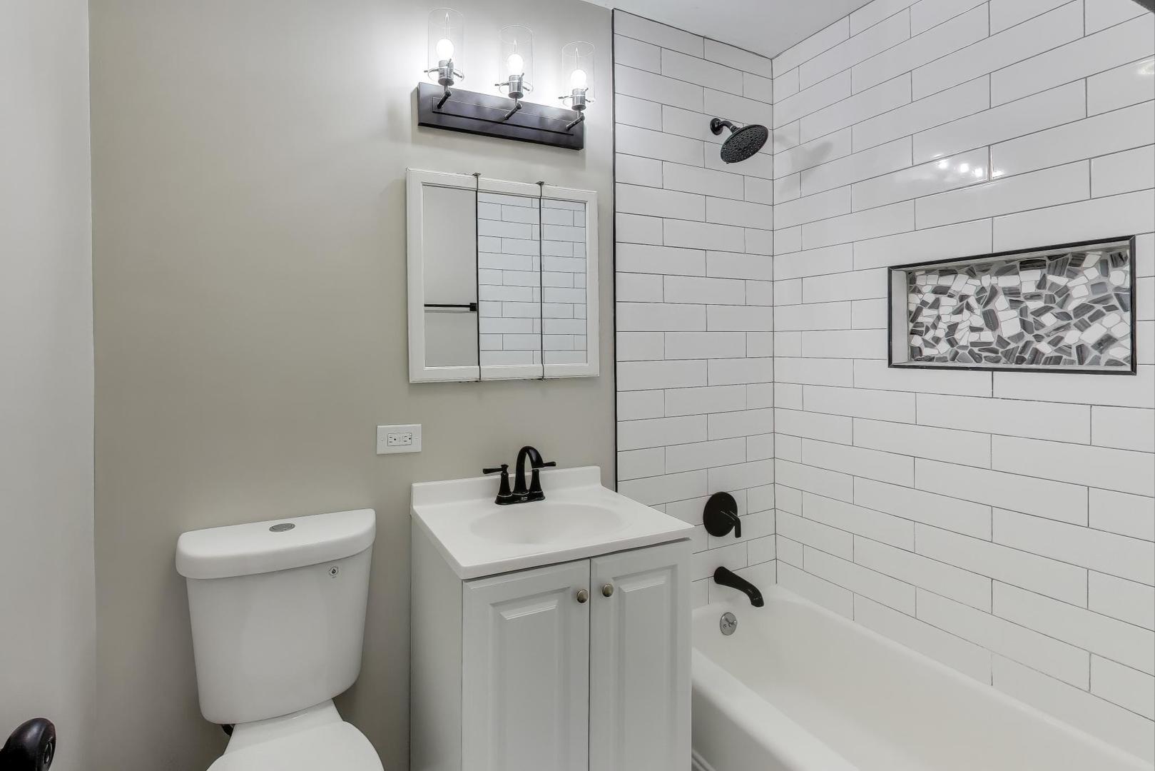 540 Newark Lane Hoffman Estates, IL 60169 - Photo 17 of 23 a bathroom with a toilet sink and mirror