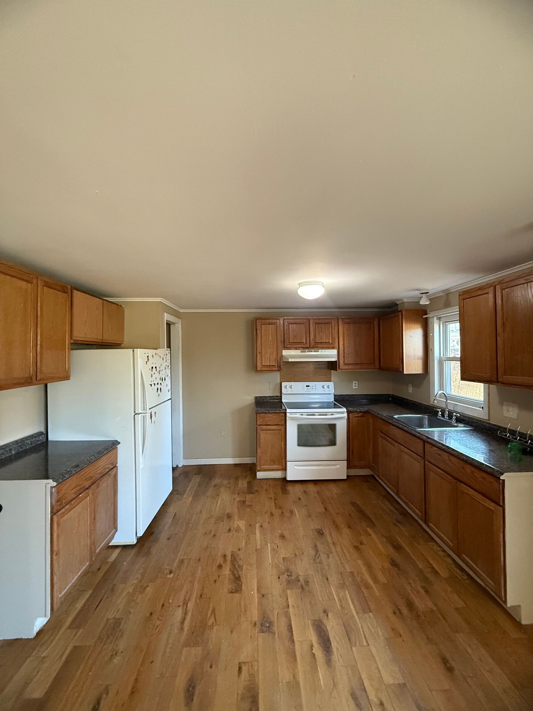 151 Fitch Street New Haven, CT 06515 - Photo 13 of 15 a kitchen with stainless steel appliances kitchen island granite countertop a stove a sink and a refrigerator