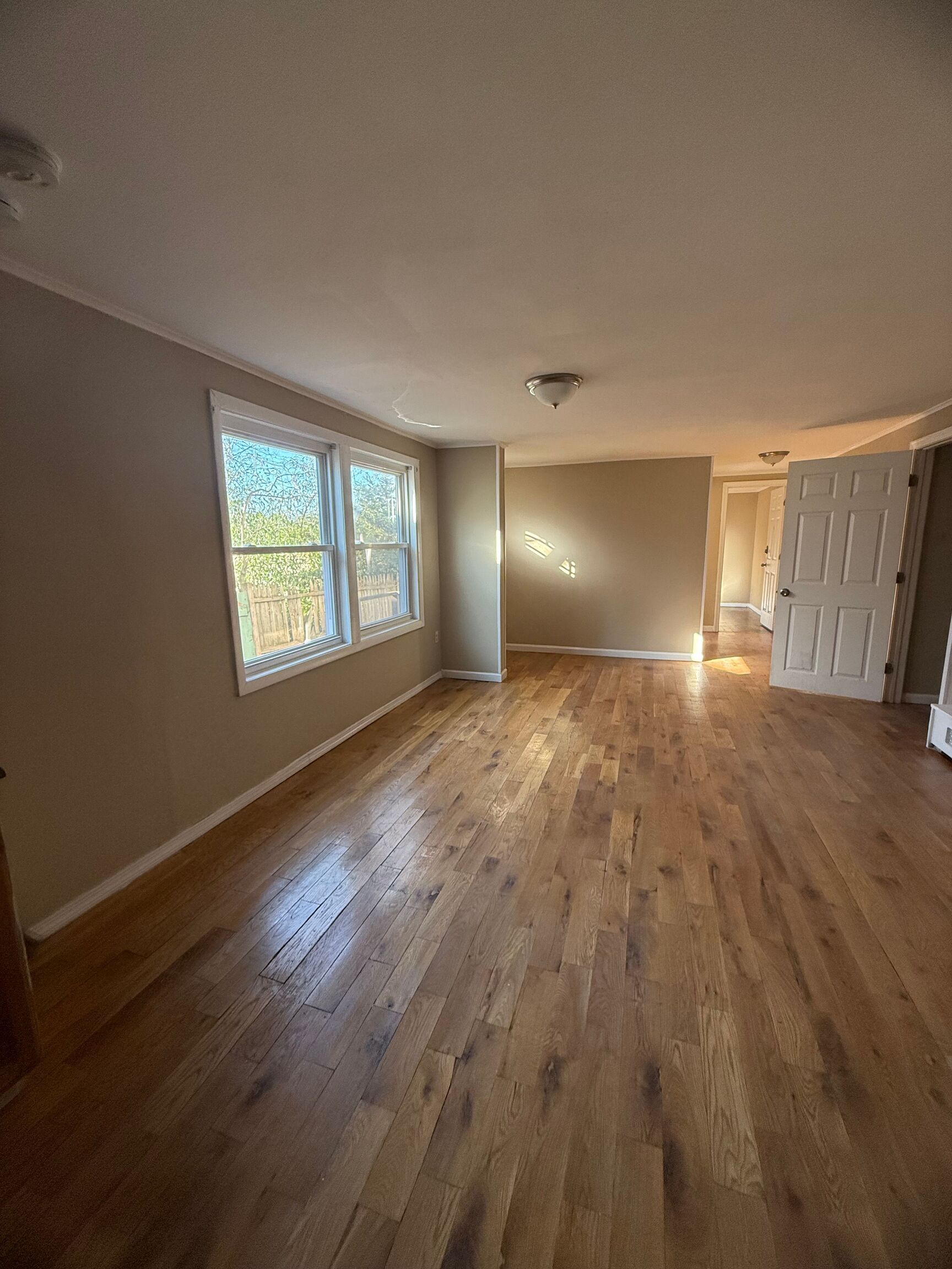 151 Fitch Street New Haven, CT 06515 - Photo 15 of 15 a view of an empty room with wooden floor and a window