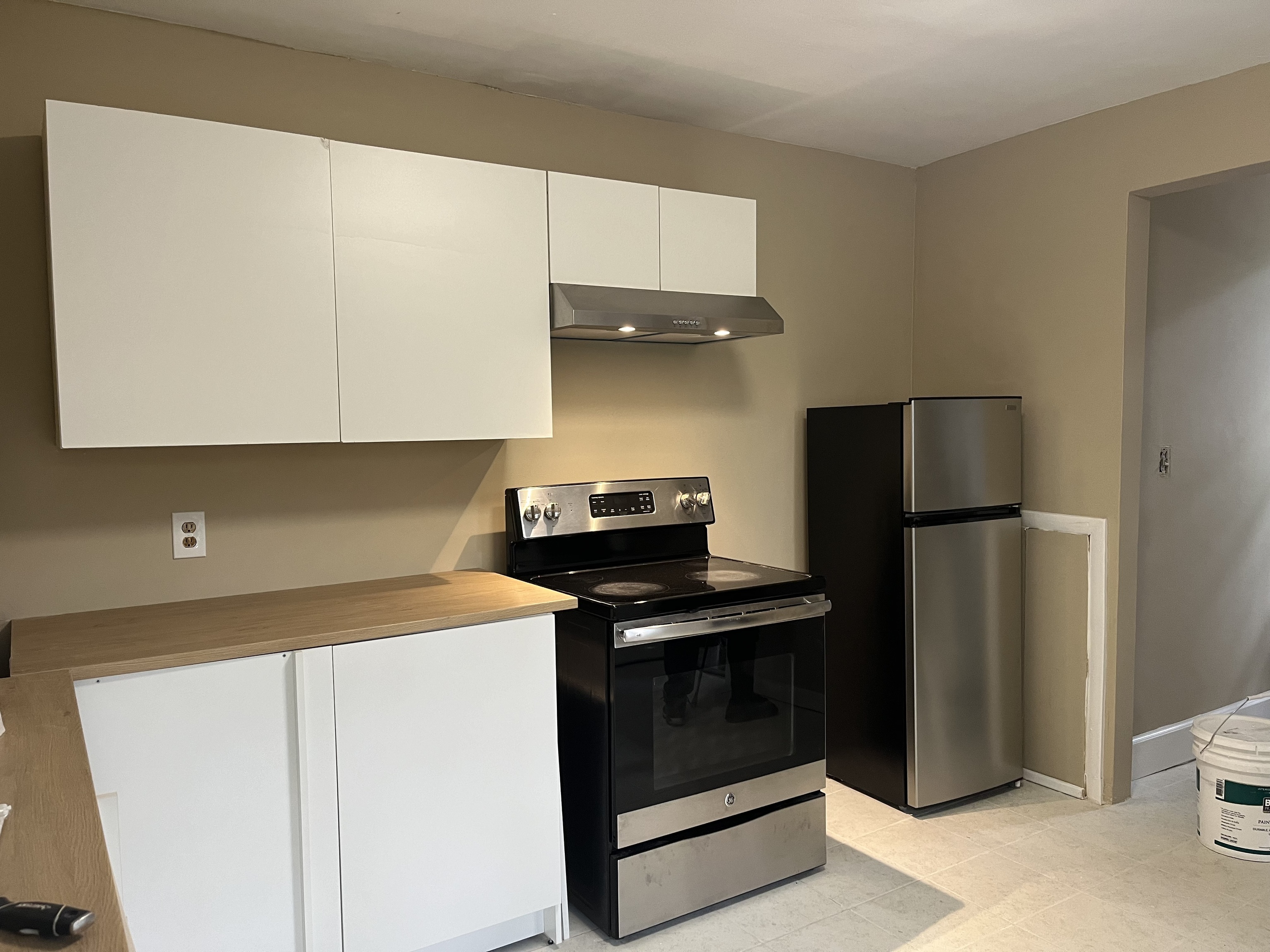 151 Fitch Street New Haven, CT 06515 - Photo 8 of 15 a kitchen with a stove and a refrigerator