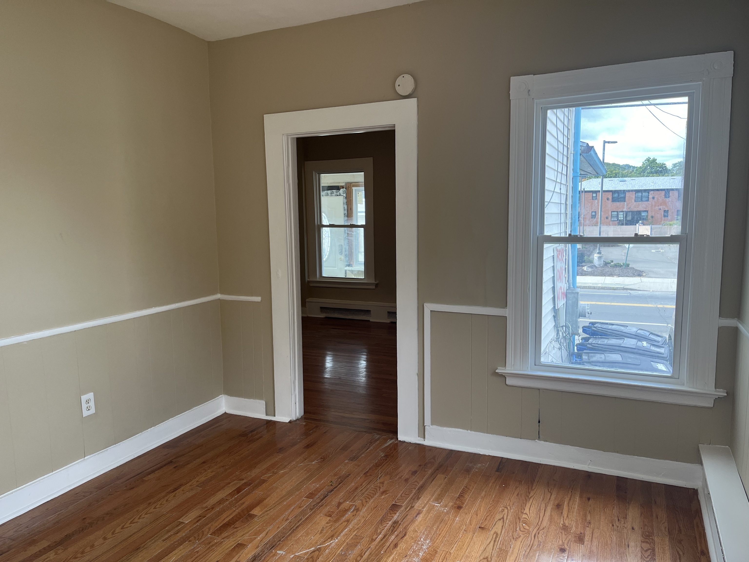151 Fitch Street New Haven, CT 06515 - Photo 9 of 15 an empty room with wooden floor and windows