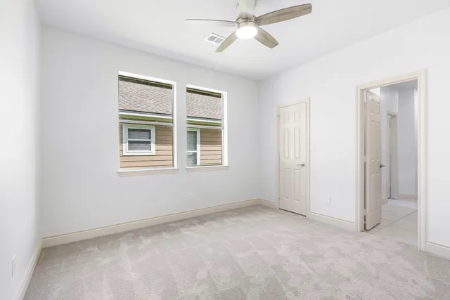 a view of empty room with windows