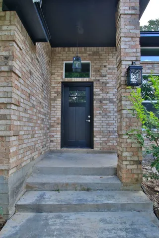 a front view of a house with stairs