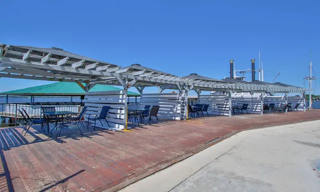 a view of a chairs and table in the balcony