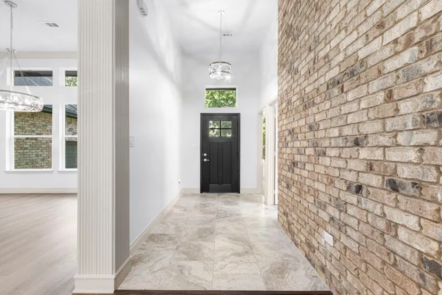 a view of an entryway with wooden floor