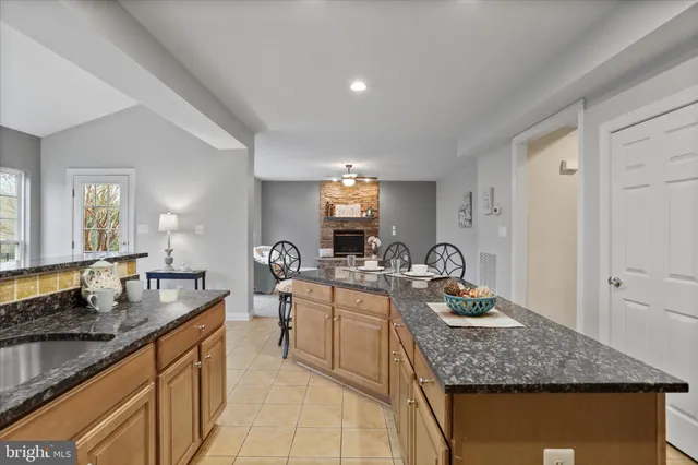 a kitchen with sink stove and cabinets