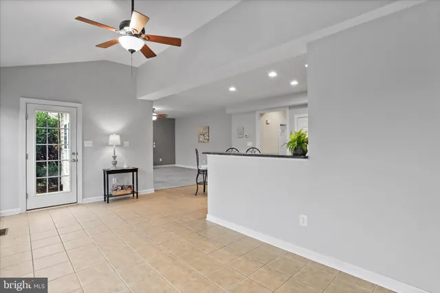 a view of a livingroom with a kitchen and a stove