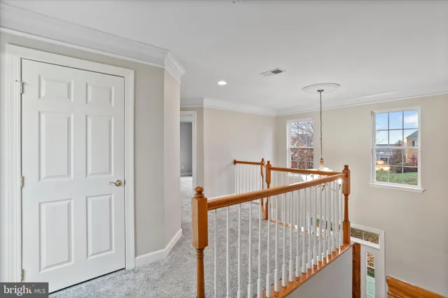 a view of a hallway with stairs