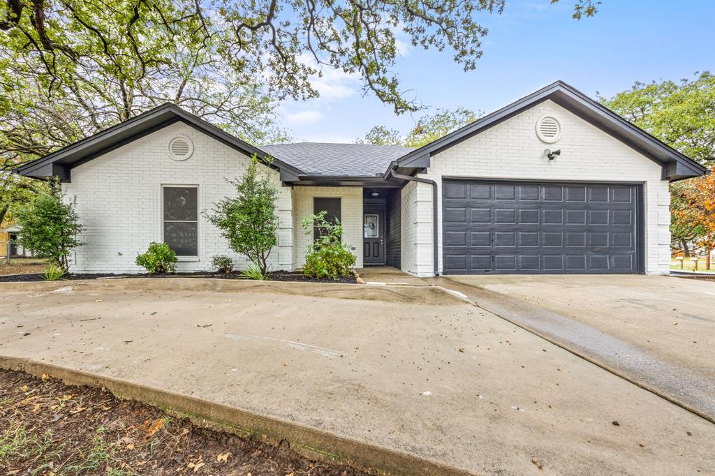 217 Spring Branch Trail South Springtown, TX 76082 - Photo 1 of 1 a front view of house with garage