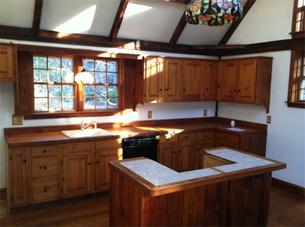 34 Garrison Road Shirley, MA 01464 - Photo 4 of 10 a kitchen that has a sink and a stove in it
