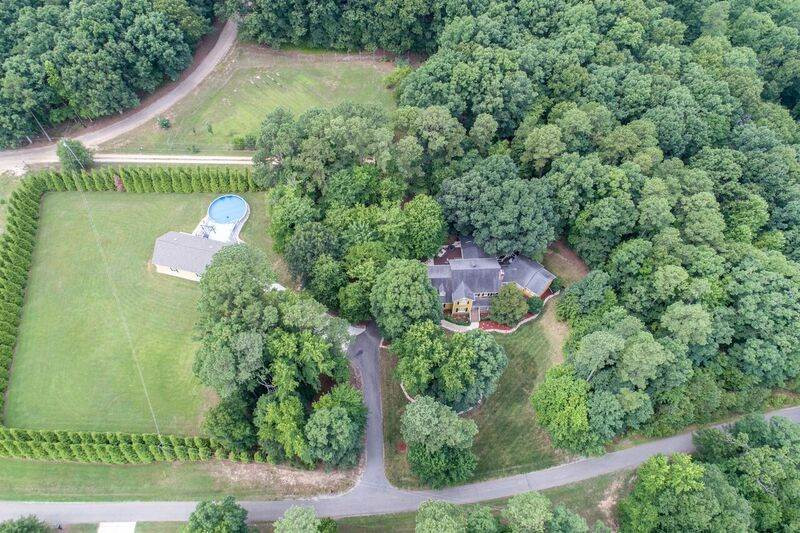 4005 Berman Edge Road Holly Springs, NC 27540 - Photo 2 of 25 Aerial view shows all of the property, buildings, and gorgeous landscaping. Aerial View of the Property