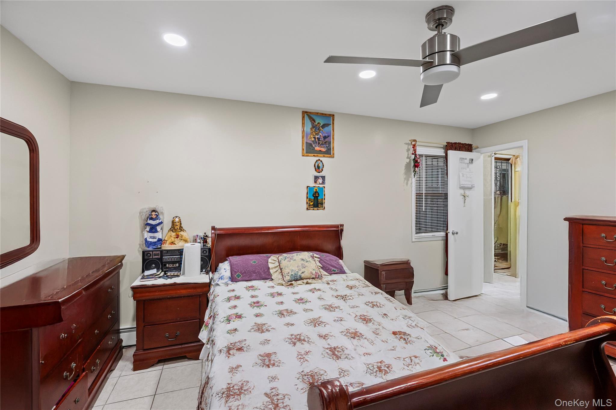 79 Union Place Hempstead, NY 11550 - Photo 14 of 26 Bedroom with light tile patterned flooring, ceiling fan, and recessed lighting