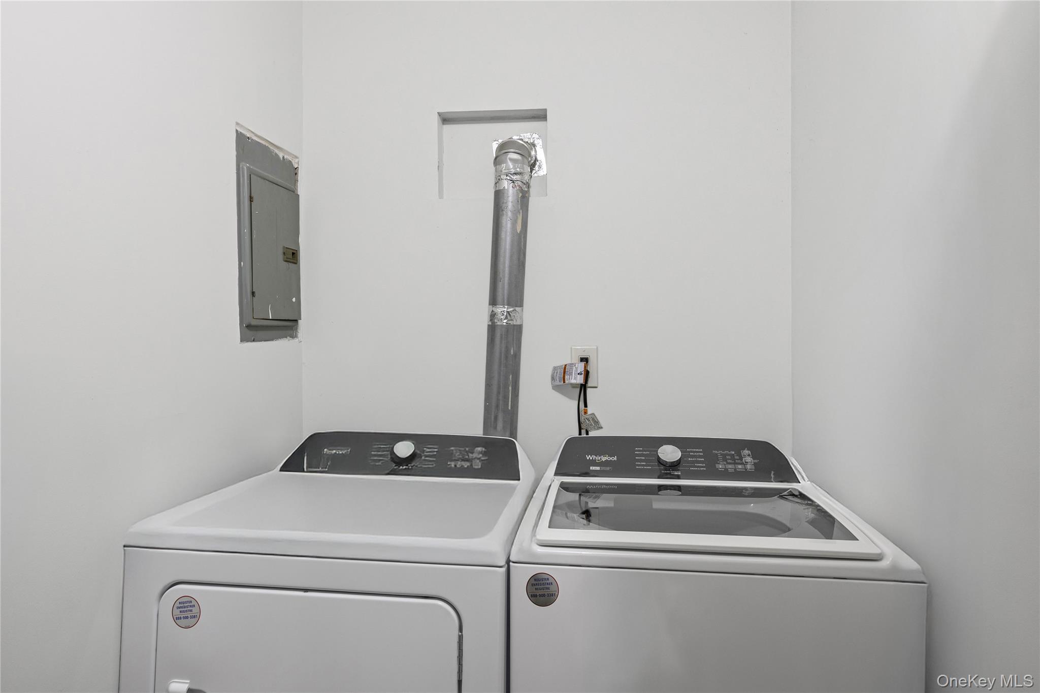 79 Union Place Hempstead, NY 11550 - Photo 19 of 26 Washroom featuring electric panel and separate washer and dryer