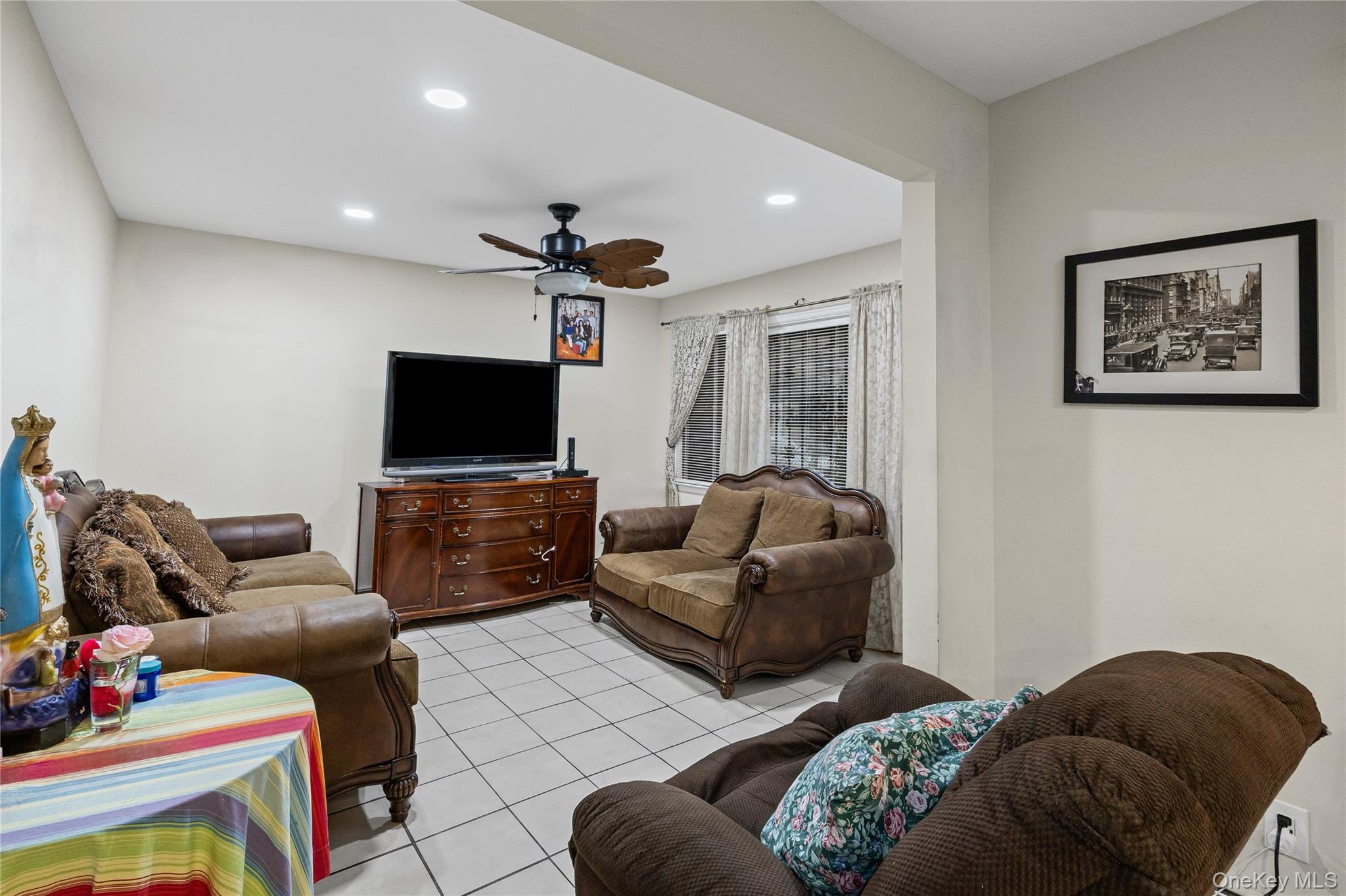 79 Union Place Hempstead, NY 11550 - Photo 5 of 26 Living area with ceiling fan, recessed lighting, and light tile patterned floors