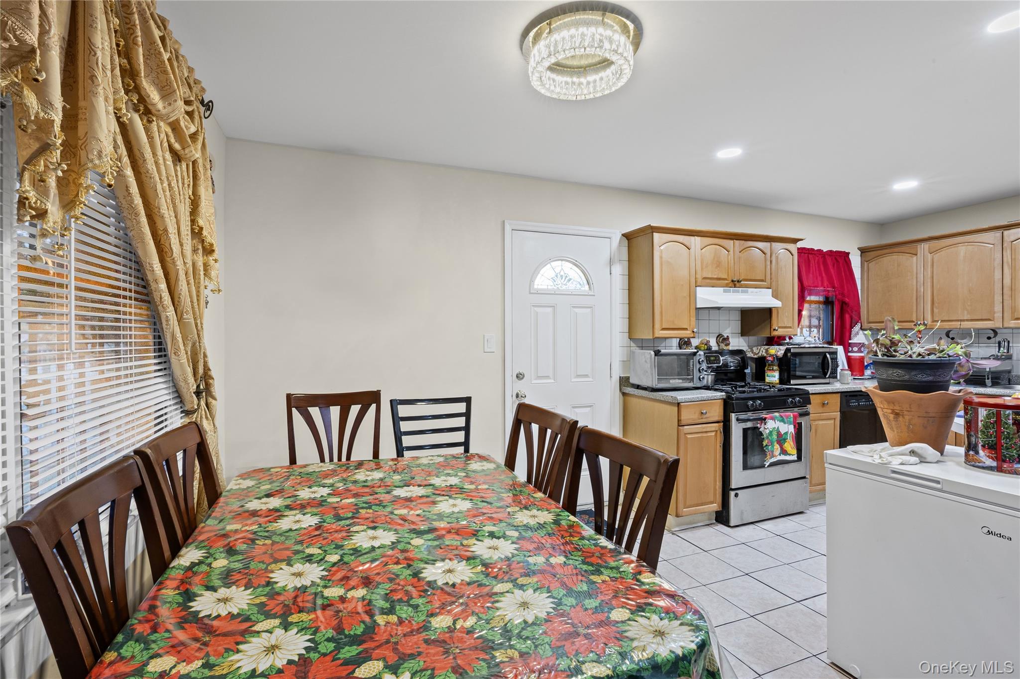 79 Union Place Hempstead, NY 11550 - Photo 7 of 26 Dining room featuring light tile patterned floors and recessed lighting