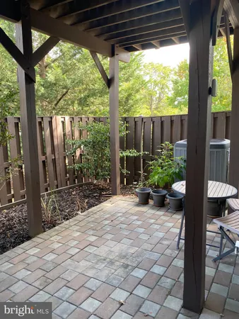 a view of a porch with chairs and backyard