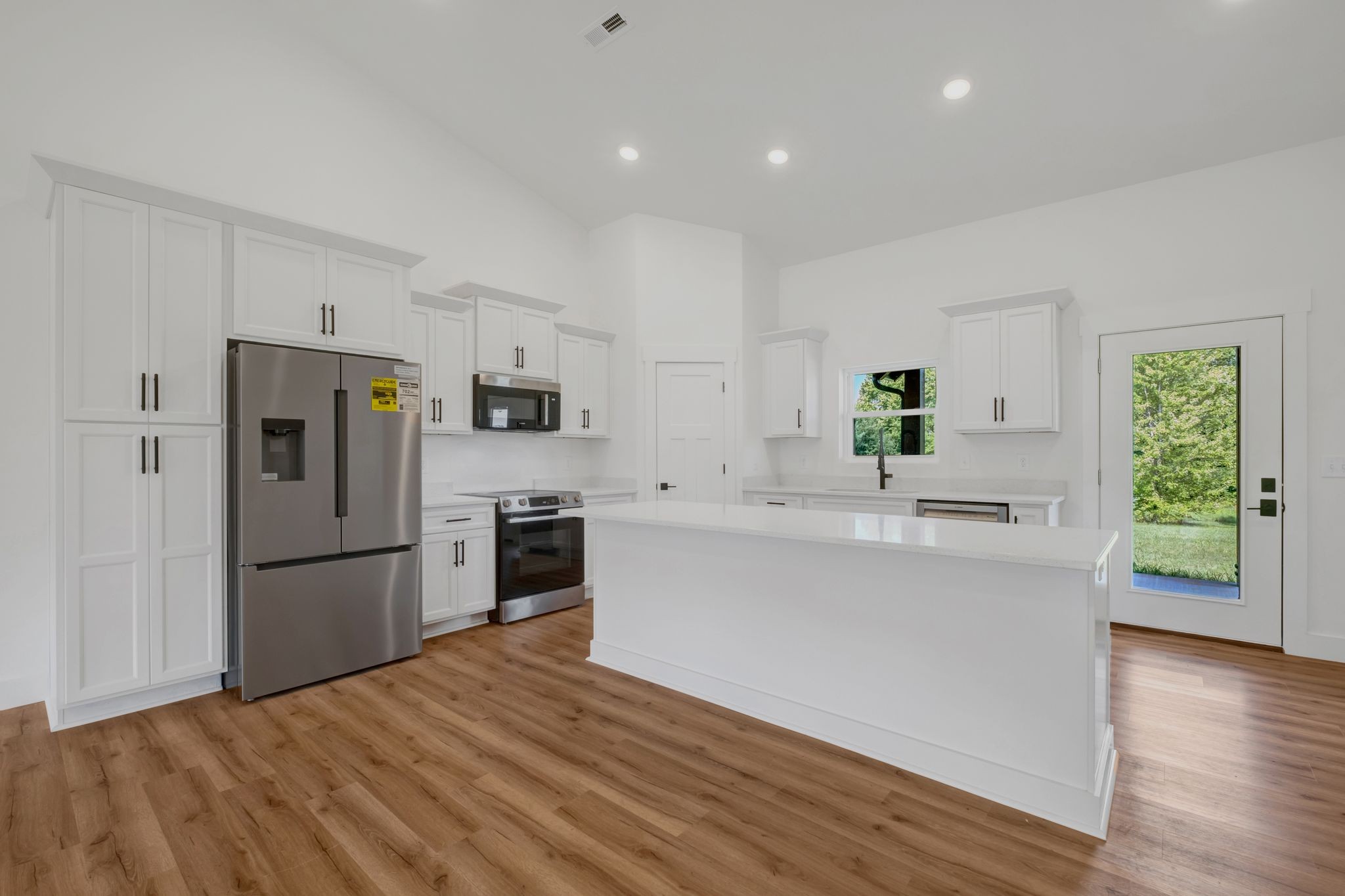 5050 Richards Road Adams, TN 37010 - Photo 12 of 52 a kitchen with a refrigerator and a stove top oven