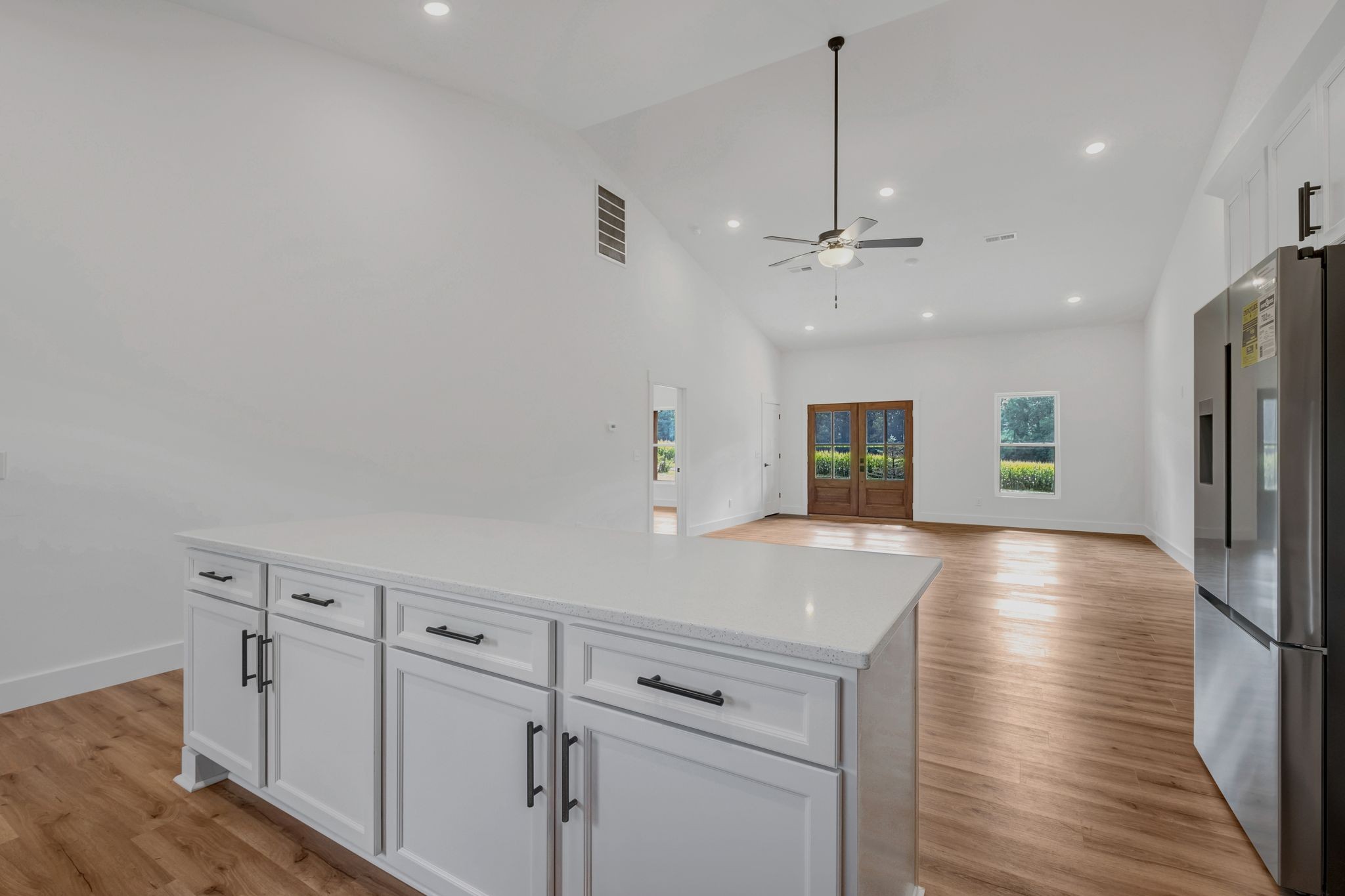 5050 Richards Road Adams, TN 37010 - Photo 16 of 52 a view of kitchen with cabinets and wooden floor