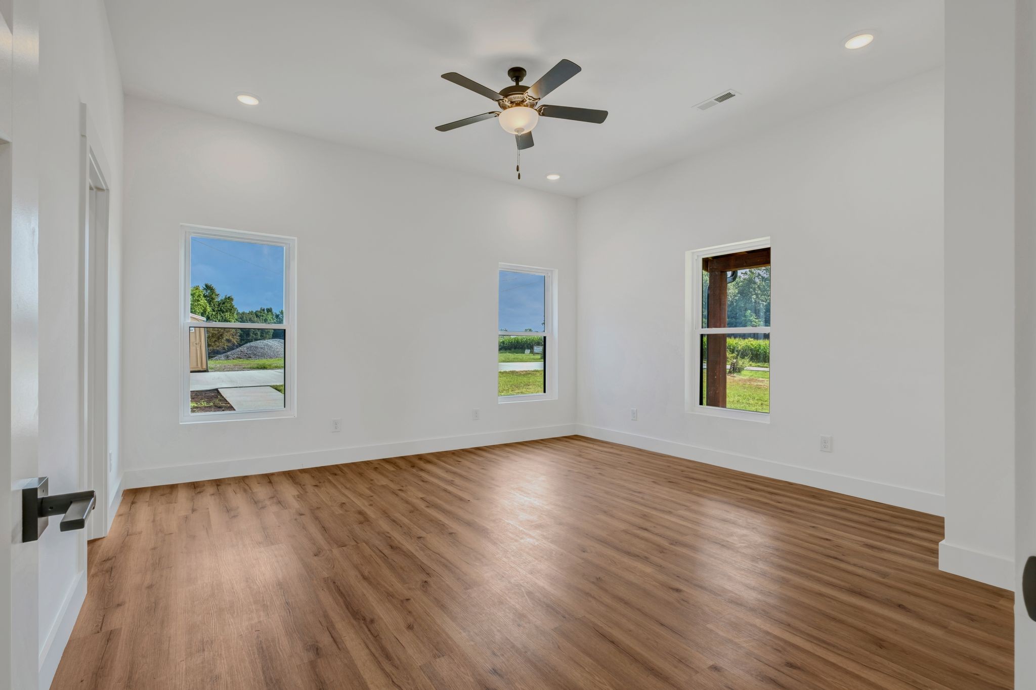 5050 Richards Road Adams, TN 37010 - Photo 18 of 52 wooden floor in an empty room with a window