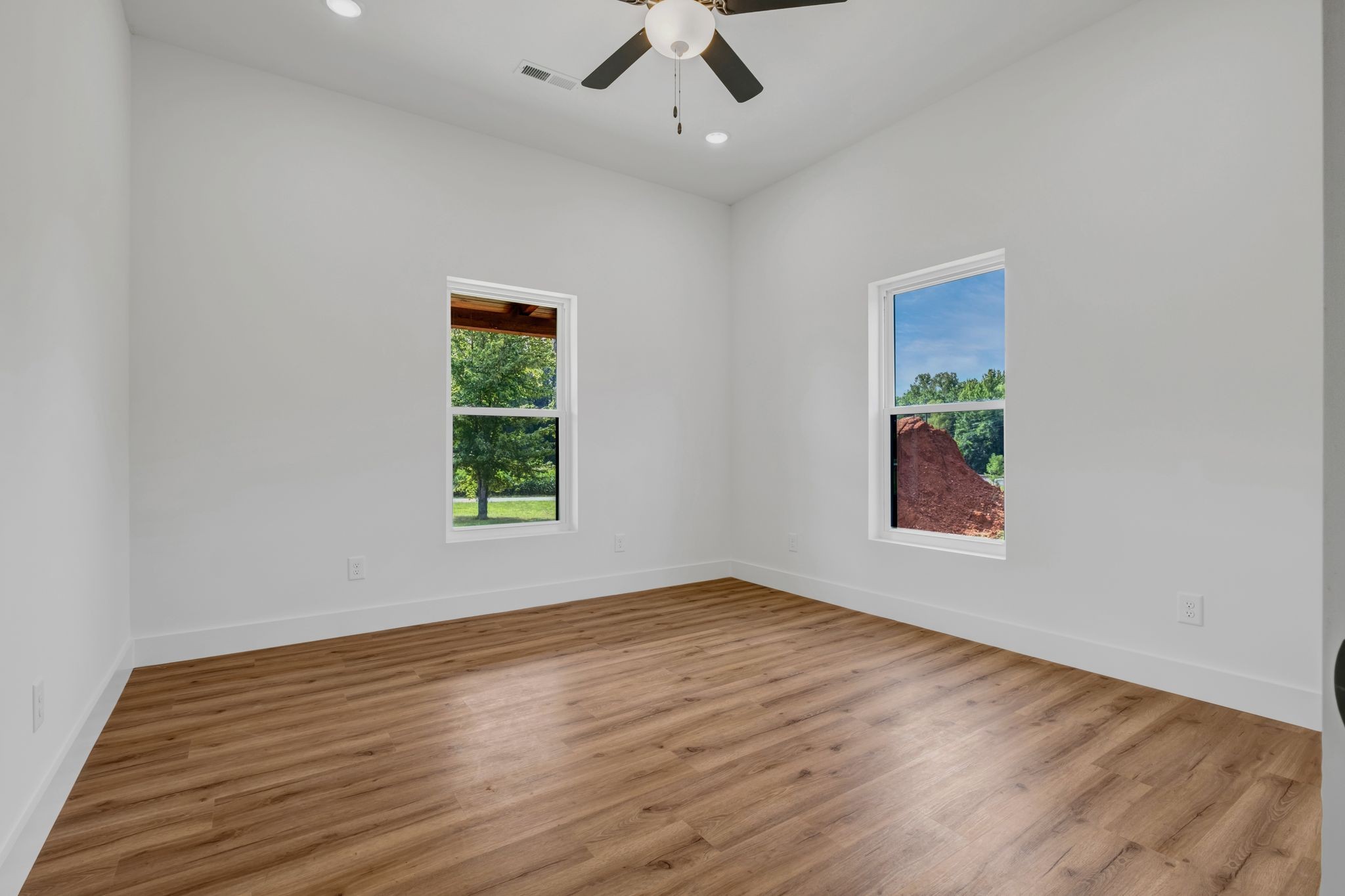 5050 Richards Road Adams, TN 37010 - Photo 29 of 52 wooden floor in an empty room with a window