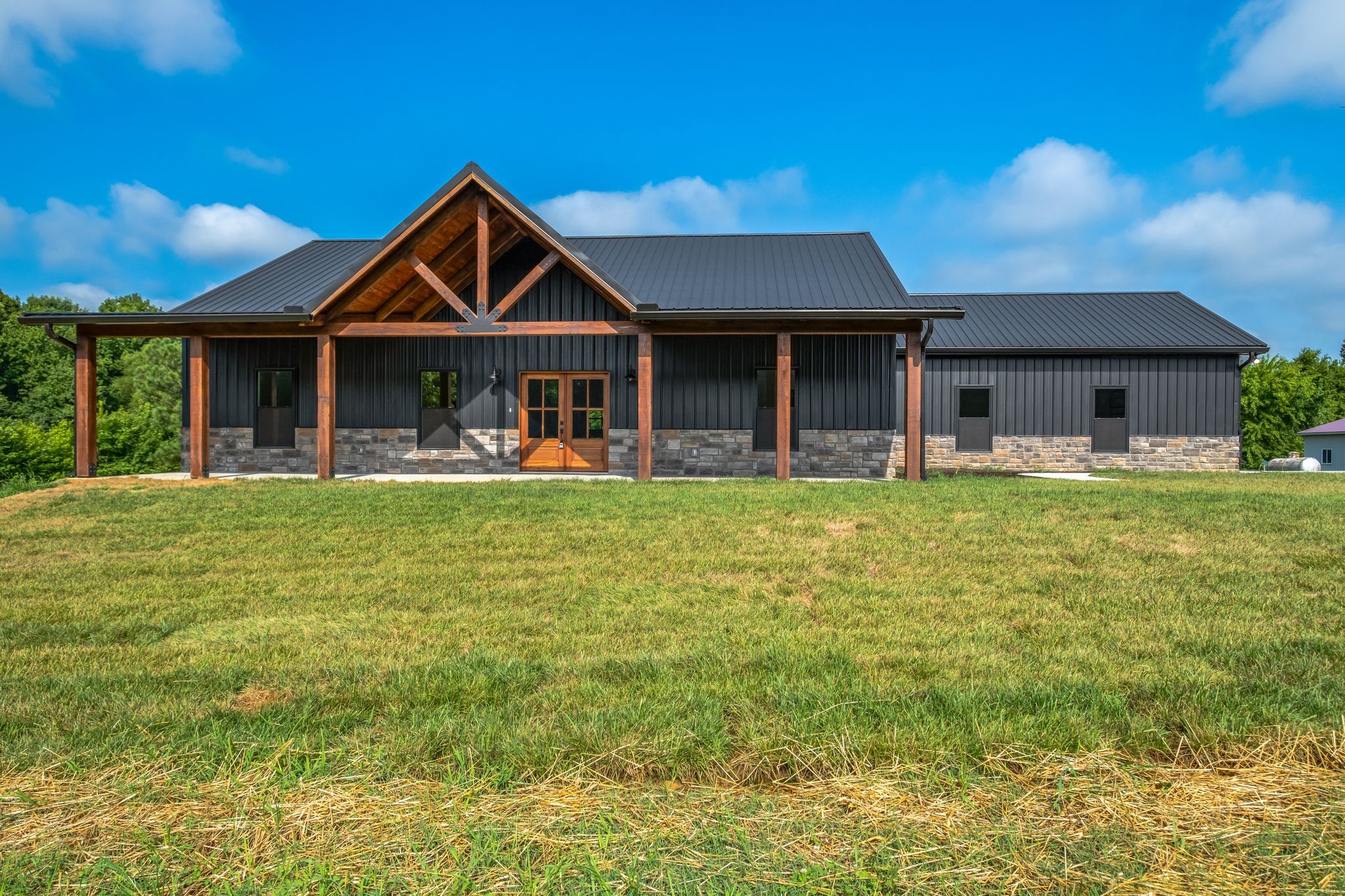 5050 Richards Road Adams, TN 37010 - Photo 3 of 52 a front view of a house with garden