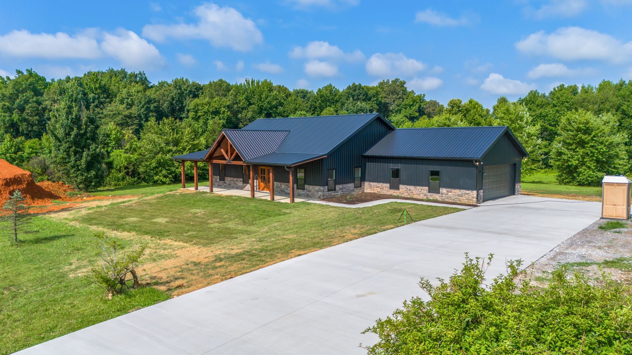5050 Richards Road Adams, TN 37010 - Photo 33 of 52 a view of a yard with table and chairs and a small yard