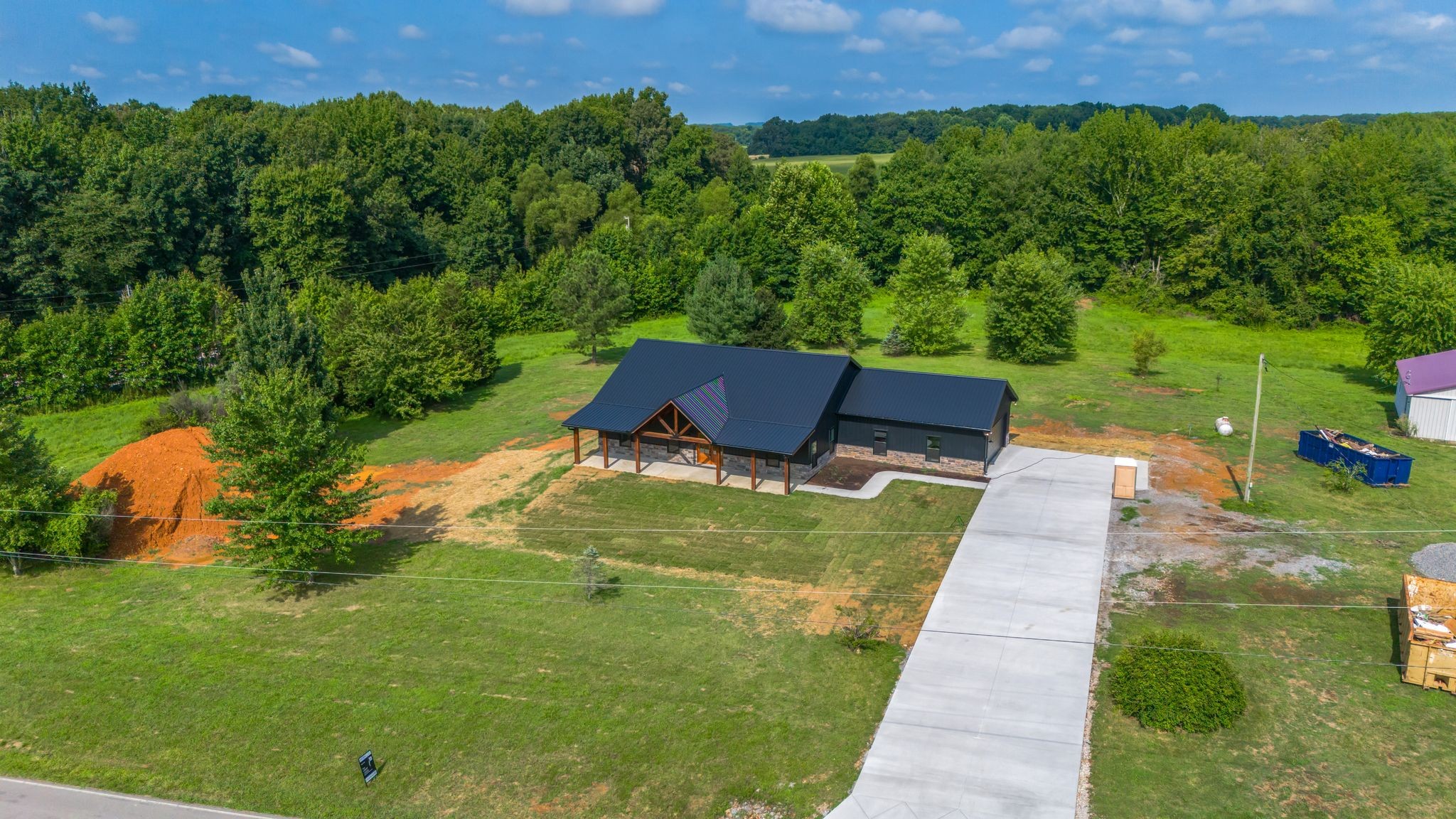 5050 Richards Road Adams, TN 37010 - Photo 37 of 52 a view of a backyard with plants and a garden