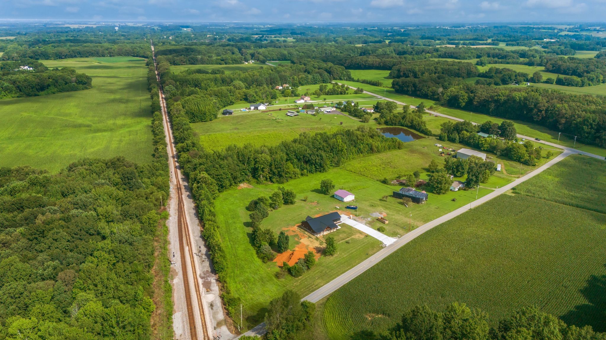 5050 Richards Road Adams, TN 37010 - Photo 43 of 52 a view of a city with lush green forest
