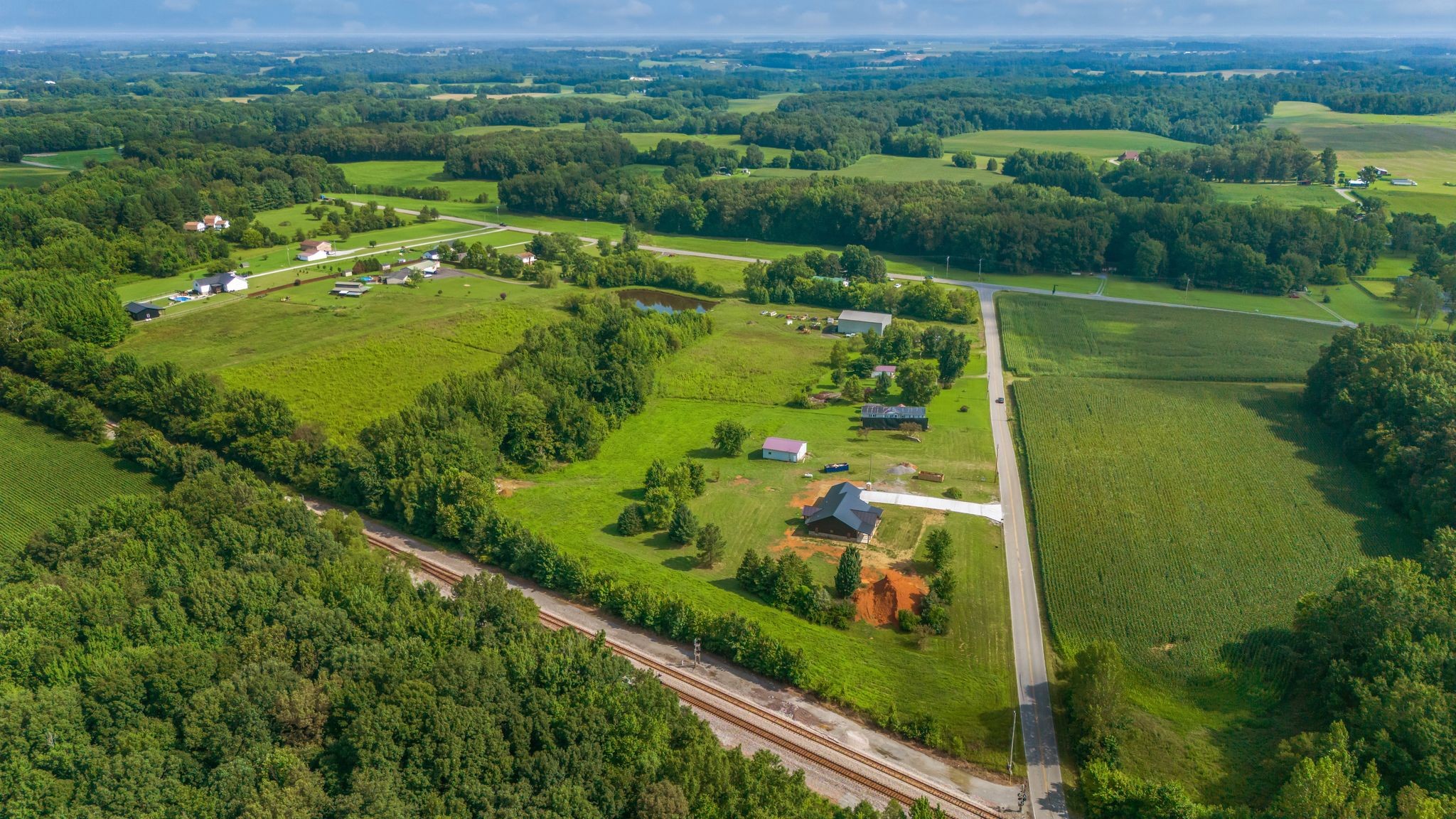 5050 Richards Road Adams, TN 37010 - Photo 45 of 52 an aerial view of a residential houses with outdoor space and trees