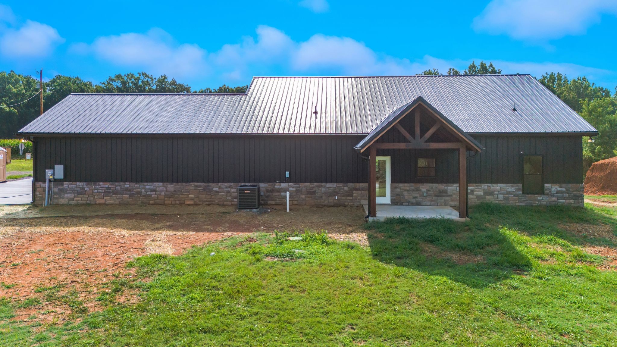 5050 Richards Road Adams, TN 37010 - Photo 50 of 52 a front view of a house with garden
