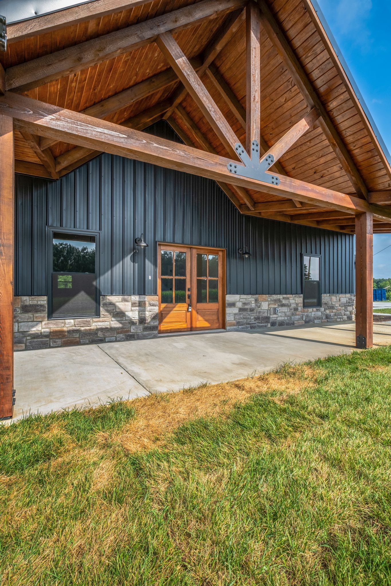 5050 Richards Road Adams, TN 37010 - Photo 5 of 52 a backyard of a house with barbeque oven table and chairs