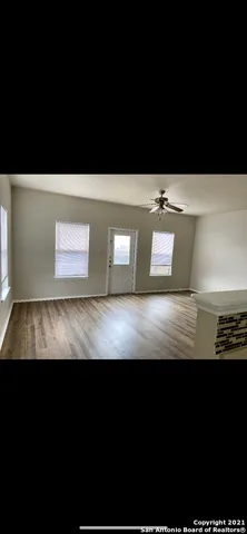 a view of wooden floor with a chair