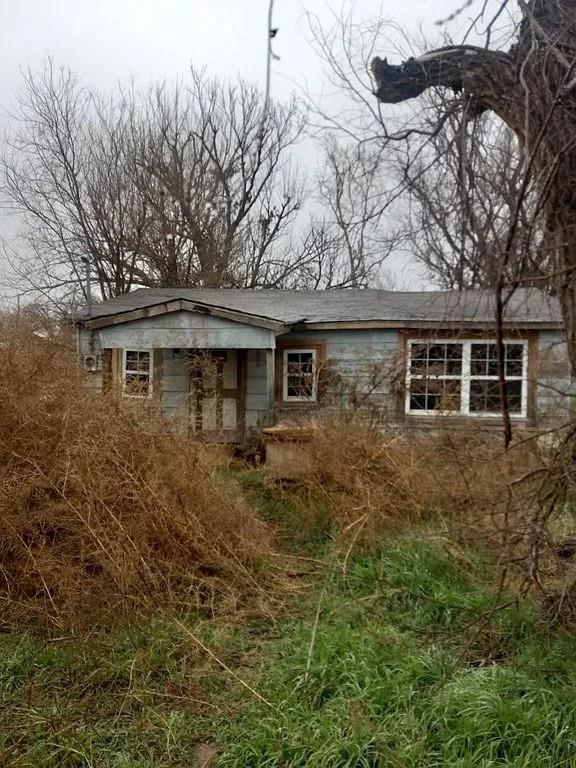 a front view of a house with yard