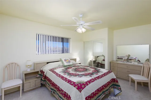 a bathroom with a sink toilet and mirror