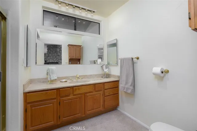 a utility room with cabinets washer and dryer