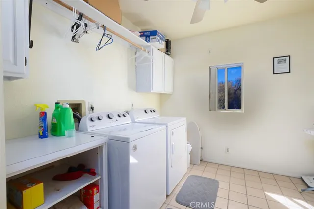 a view of a backyard with table and chairs under an umbrella