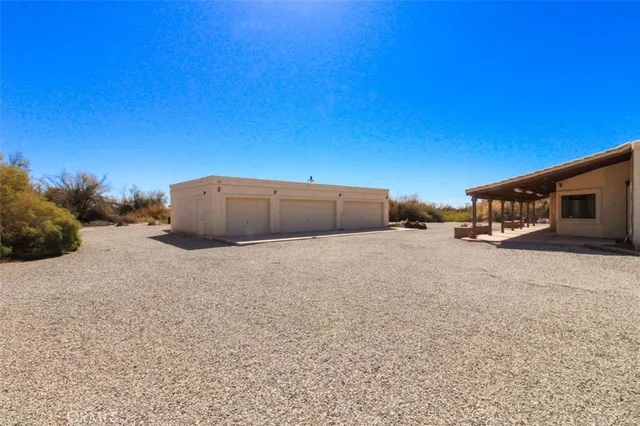 a view of a backyard of the house