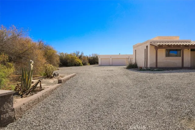 a view of a house with a backyard