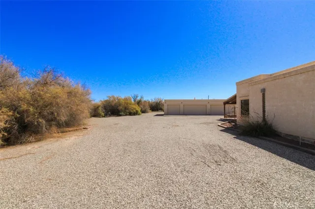 a view of a park with large trees