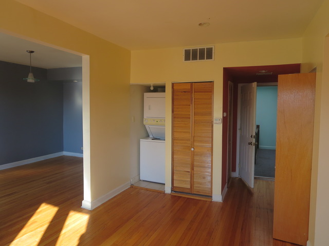 1938 East 74th Street, Unit 3 Chicago, IL 60649 - Photo 7 of 10 wooden floor in an empty room