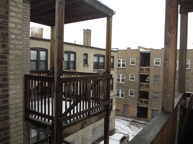 1938 East 74th Street, Unit 3 Chicago, IL 60649 - Photo 10 of 10 a view of city from balcony