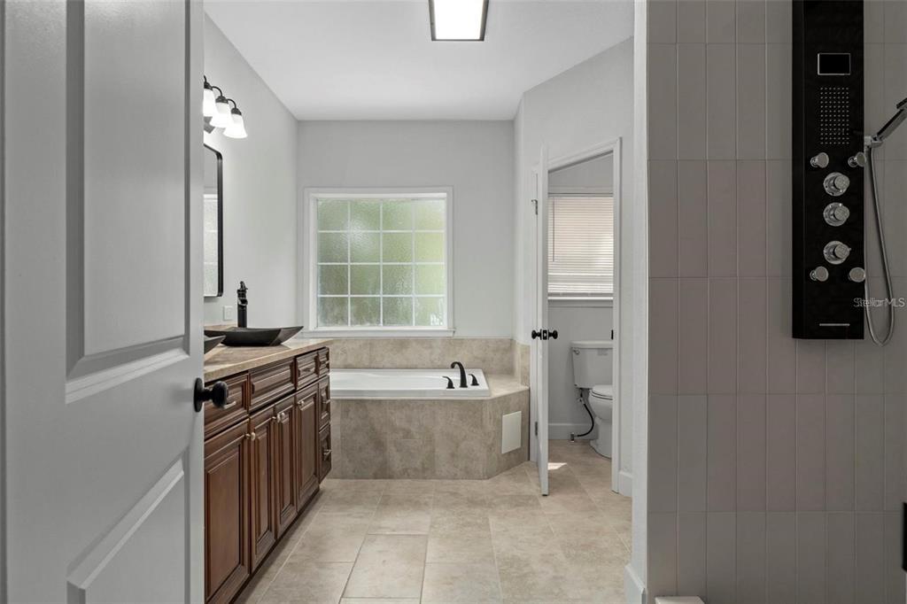 8192 Fort Dade Avenue Brooksville, FL 34601 - Photo 14 of 34 a view of a kitchen with a sink cabinet and a window