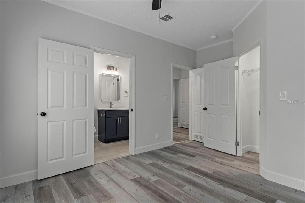 8192 Fort Dade Avenue Brooksville, FL 34601 - Photo 18 of 34 a view of a hallway with wooden floor and closet