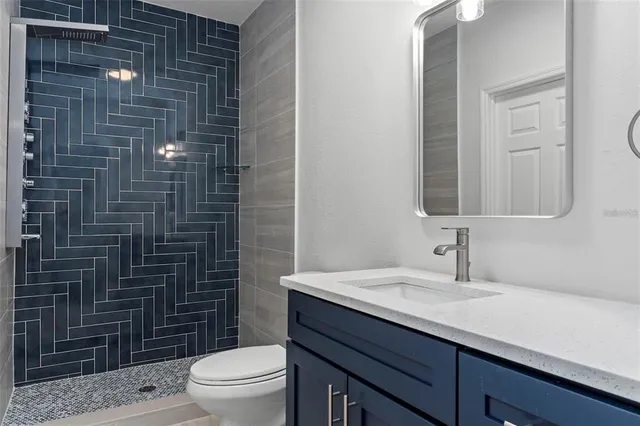 a view of a livingroom with wooden floor and closet area