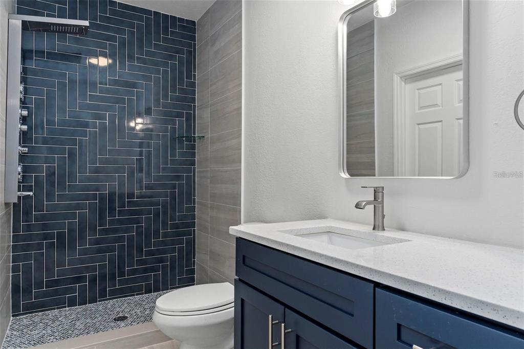 8192 Fort Dade Avenue Brooksville, FL 34601 - Photo 20 of 34 a bathroom with a sink a toilet and shower