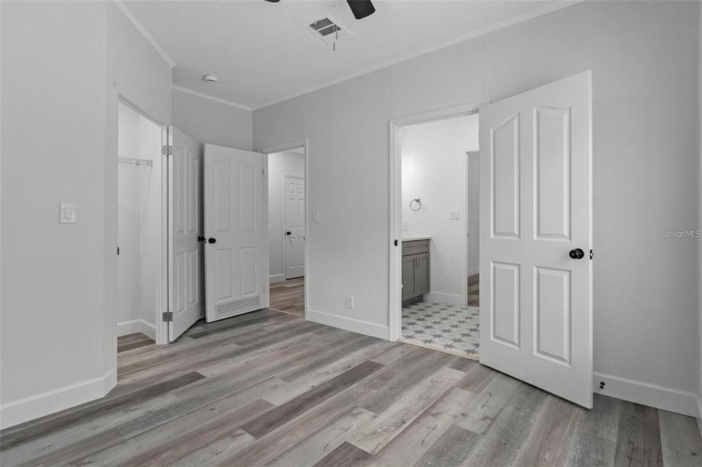 8192 Fort Dade Avenue Brooksville, FL 34601 - Photo 21 of 34 a view of a livingroom with wooden floor and closet area
