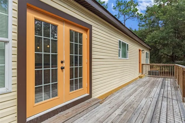a view of outdoor space with deck and yard