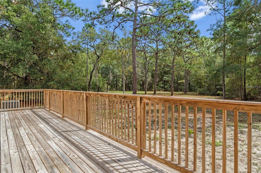 8192 Fort Dade Avenue Brooksville, FL 34601 - Photo 29 of 34 a view of balcony with wooden floor and fence